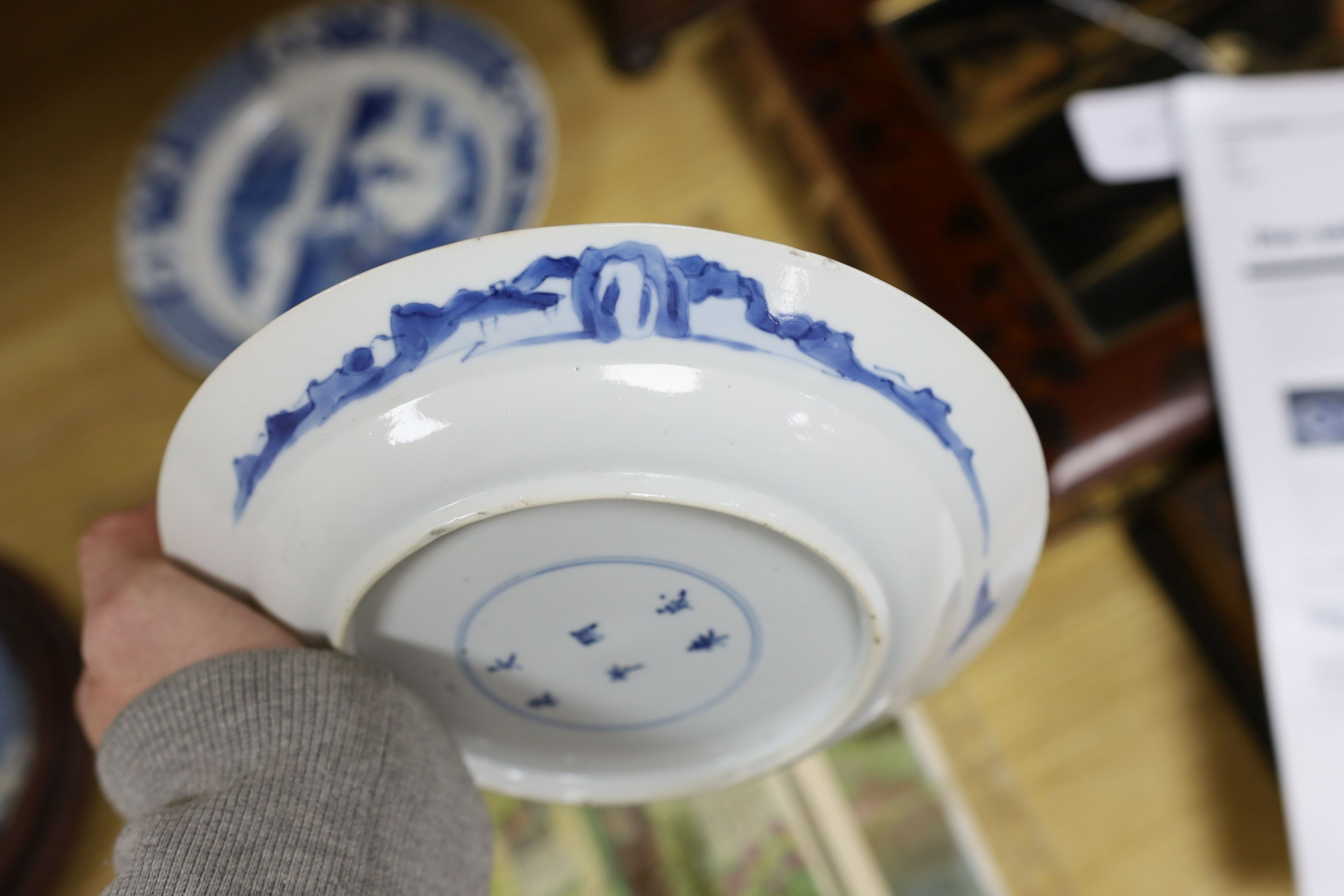 Two Chinese blue and white plates, Kangxi period, one with Kangxi mark the other a Chenghua mark, 21 cms diameter